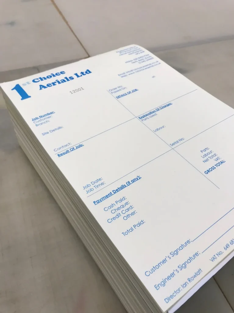Stack of printed job sheets for Aerials company