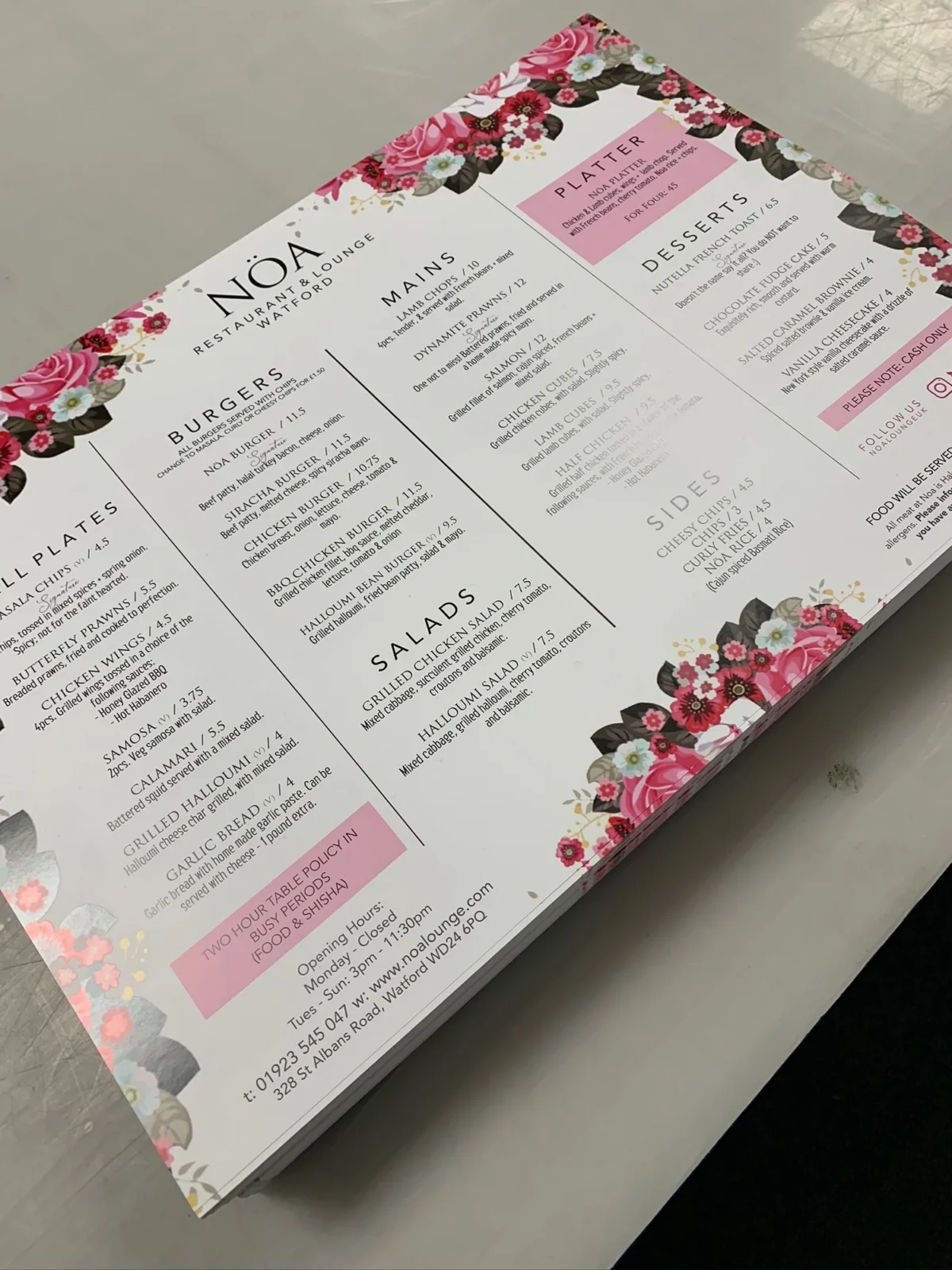 Floral-bordered NOA restaurant menu displaying dishes and prices