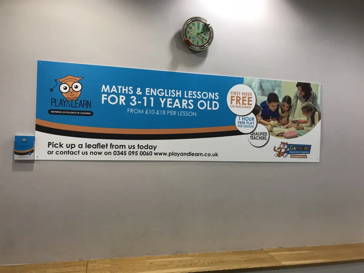 Play&Learn maths and English lessons banner beneath children’s clock