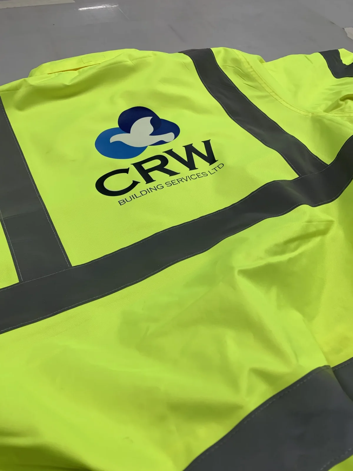 High-visibility CRW Building Services Ltd work jacket