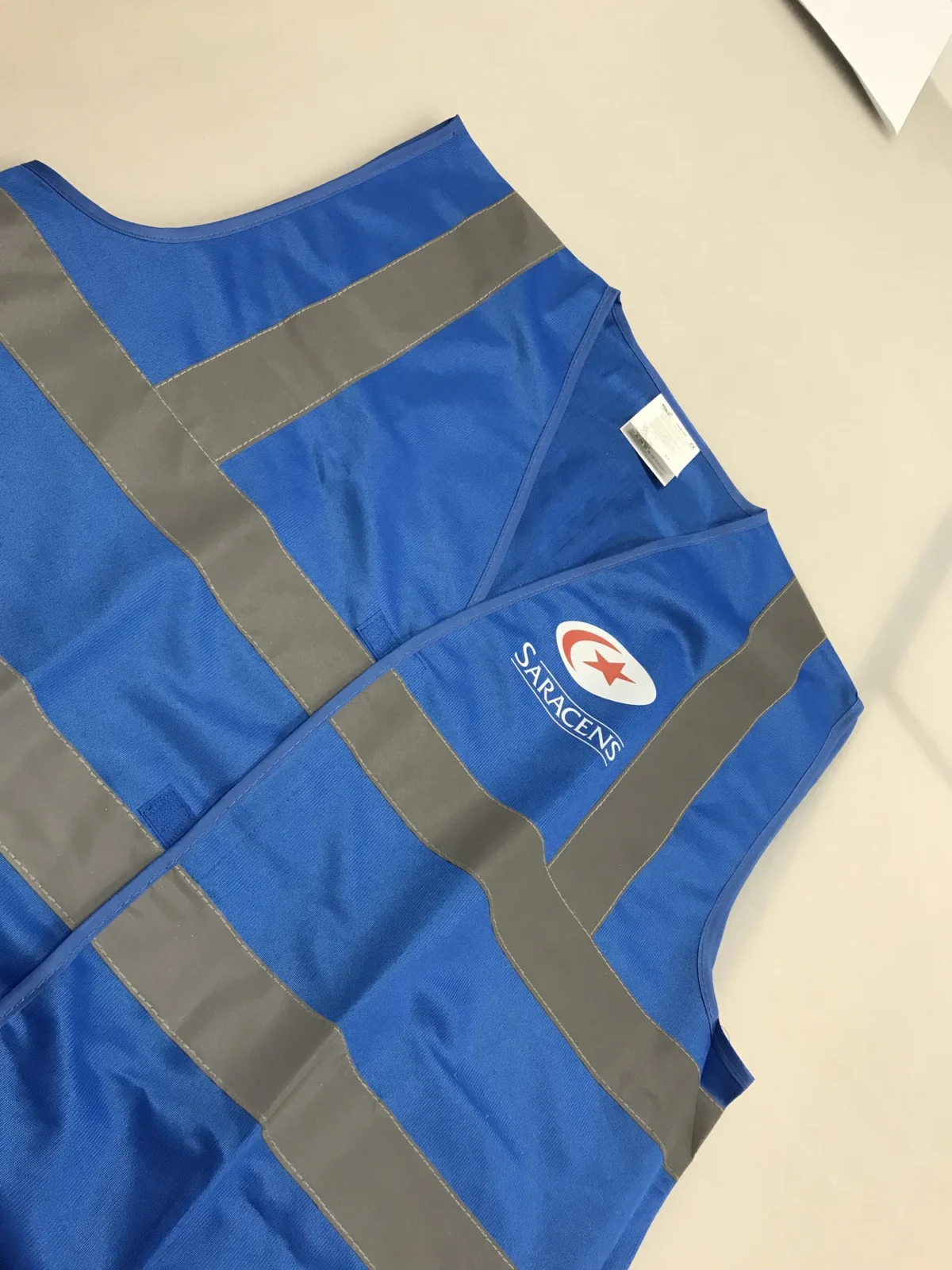 Blue Saracens high-visibility vest with reflective strips