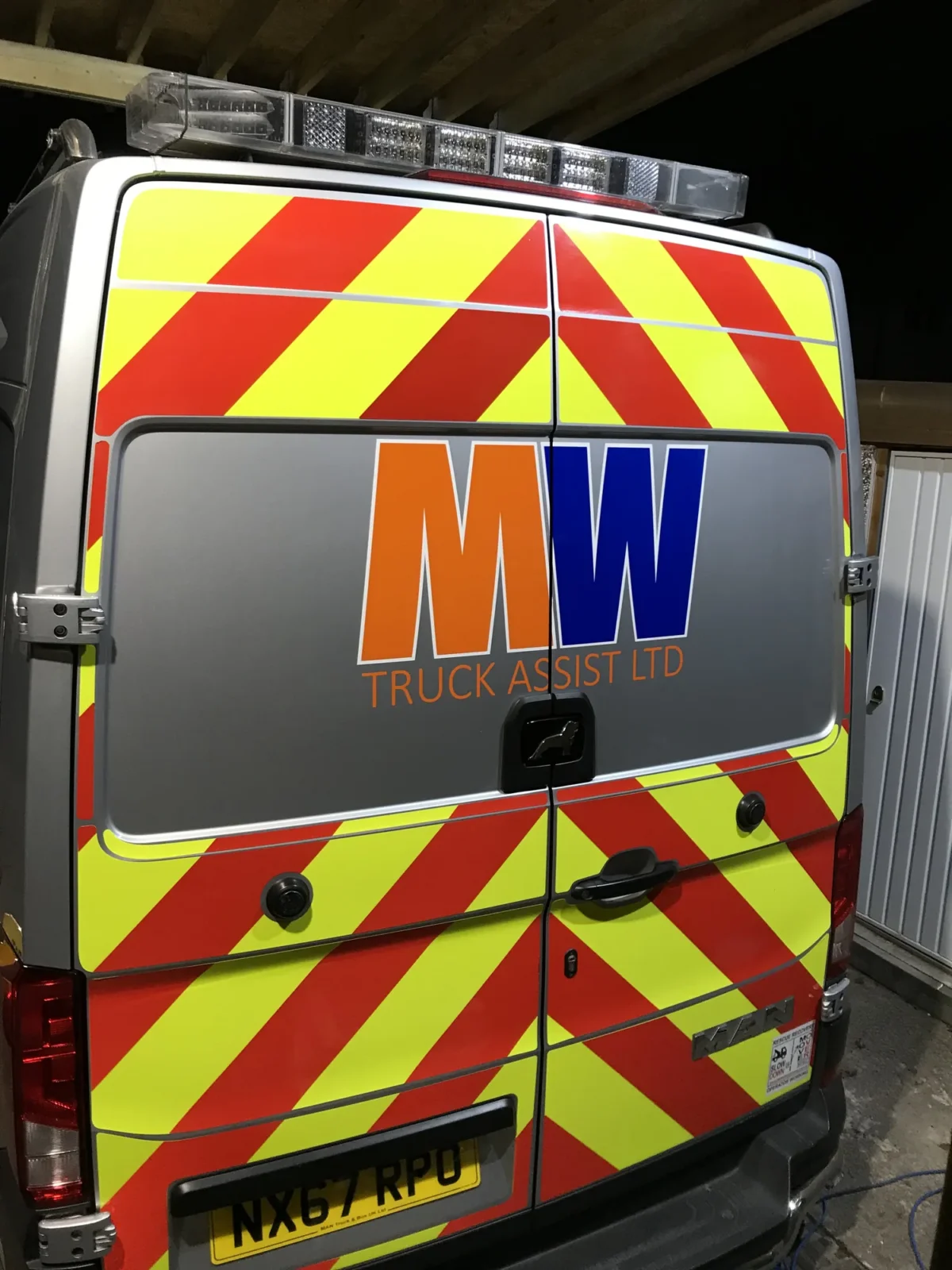 Rear of MW Truck Assist van with high-visibility chevrons