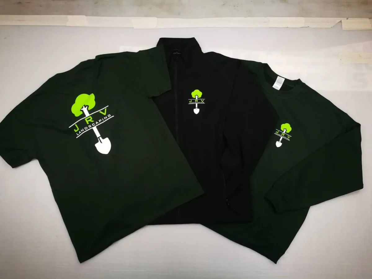 Landscaping branded polo shirts and black zip-up jacket