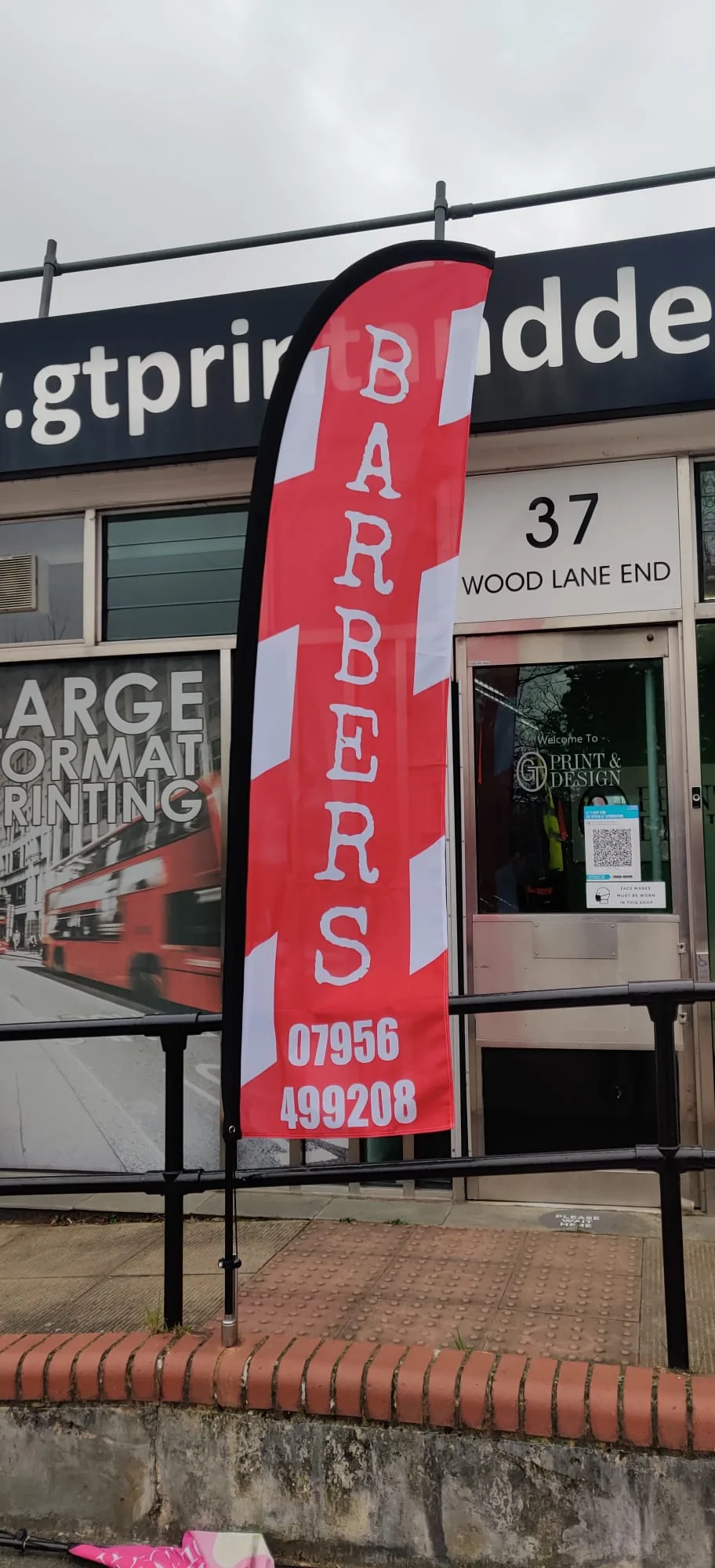 Barbers flag outside GT Print and Design shop