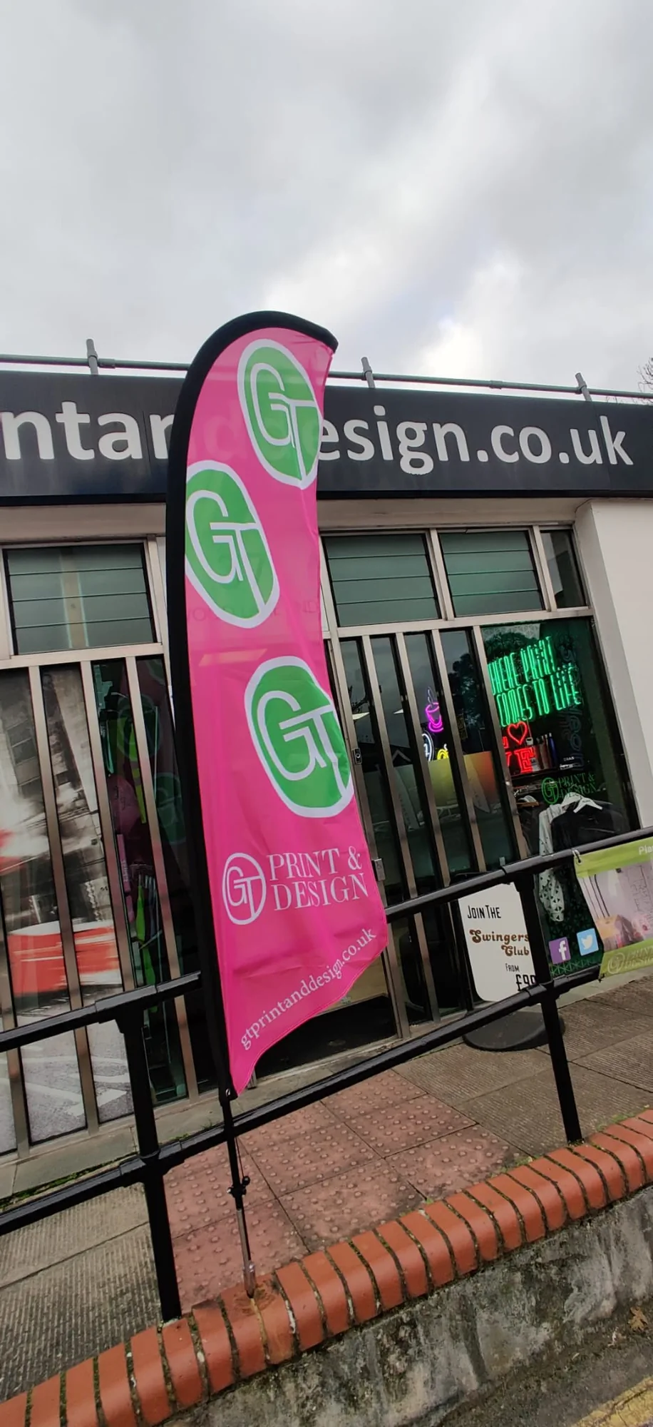 Pink Print and Design flag outside shopfront