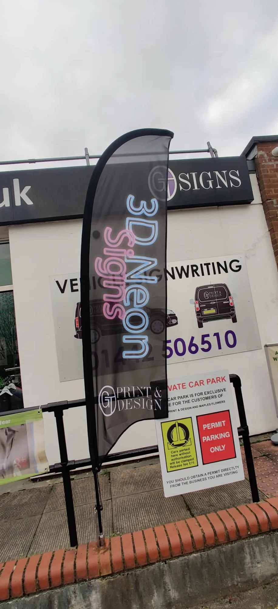 3D signs feather flag outside Print and Design shop