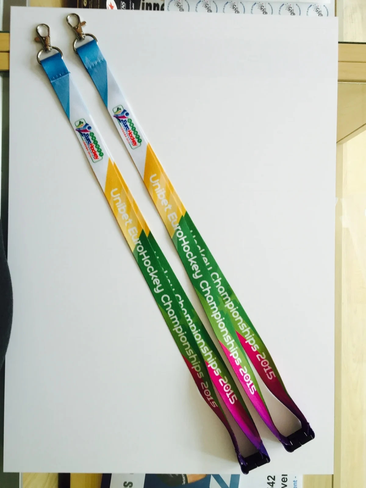 Two 2015 Unibet EuroHockey Championships branded lanyards with clips