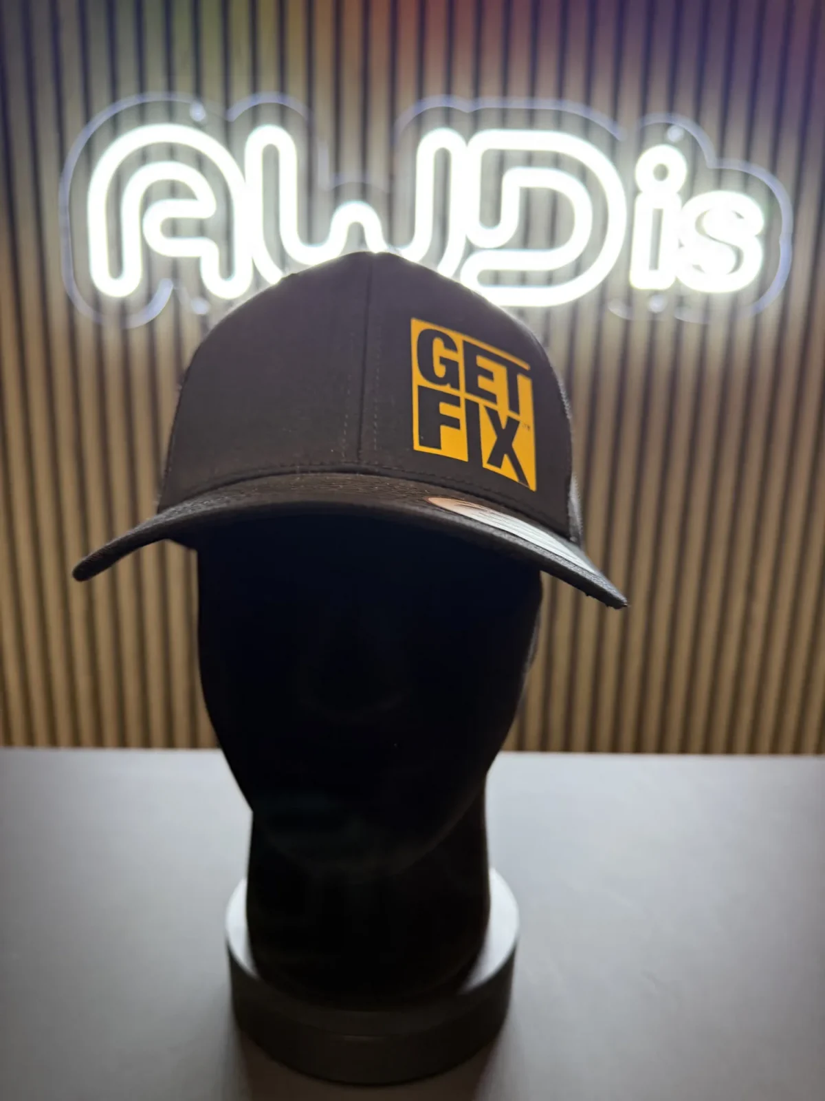 Black Get Fix cap displayed on a mannequin head