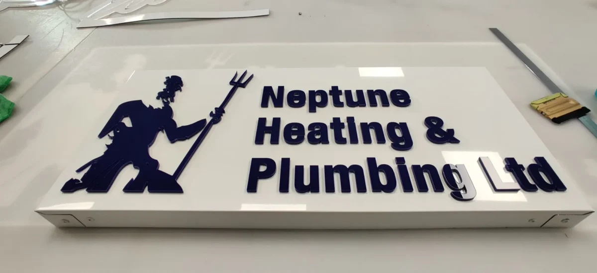 Neptune Heating and Plumbing Ltd sign with trident logo