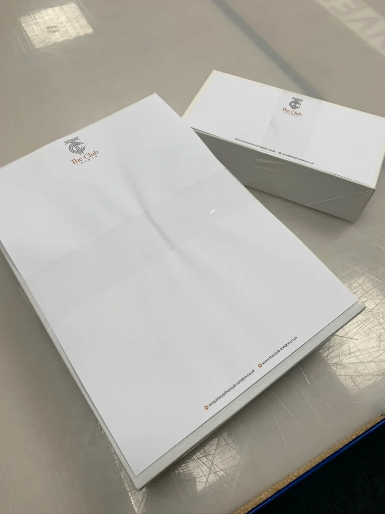 Branded white presentation folders and box for The Club London