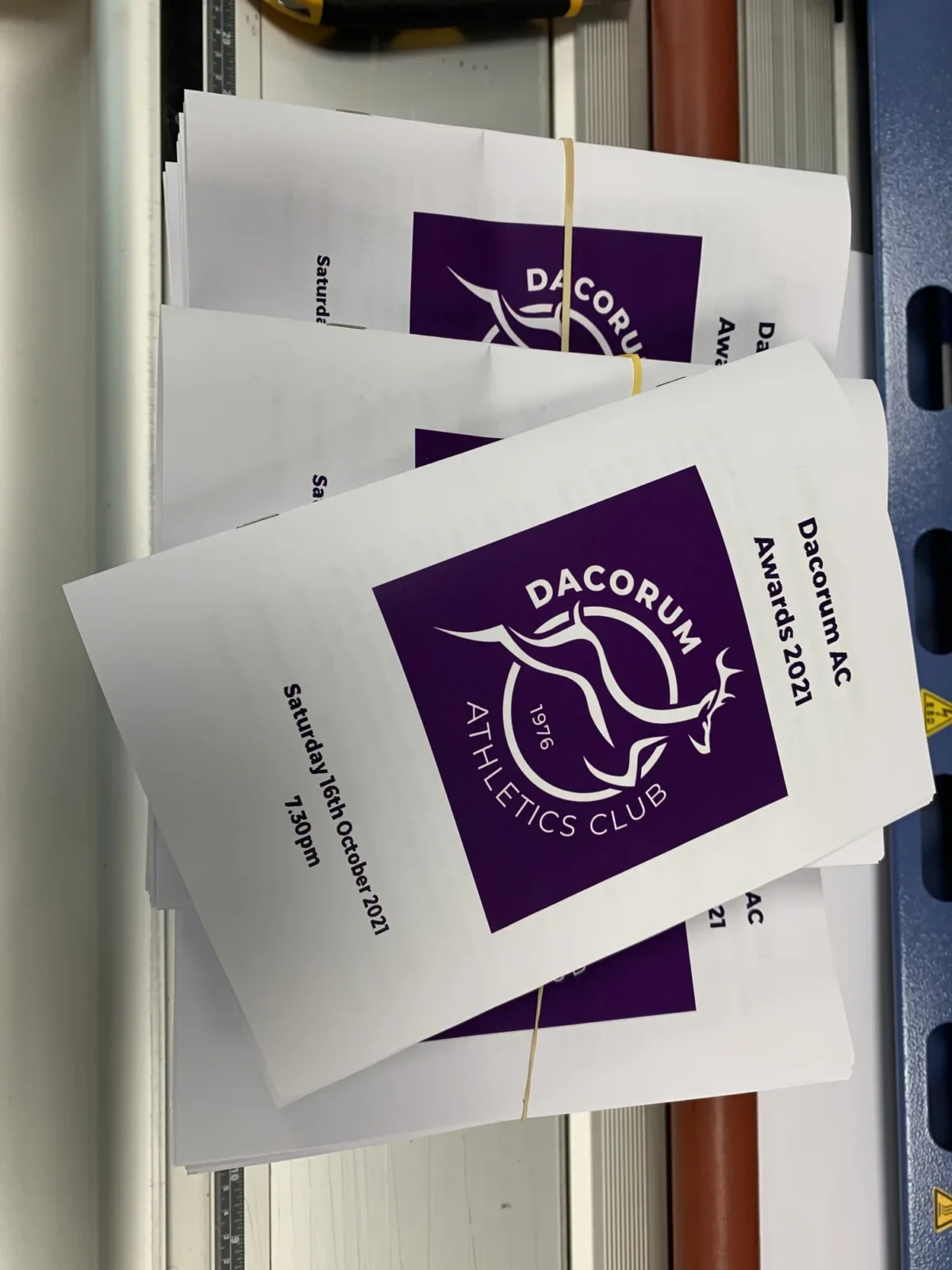 Stacks of Dacorum Athletics Club Awards 2021 programmes