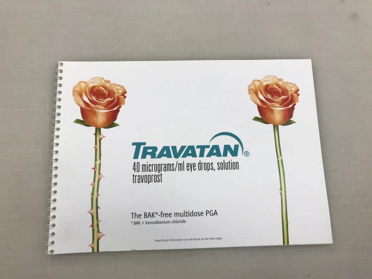 Travatan eye drops booklet with two orange roses
