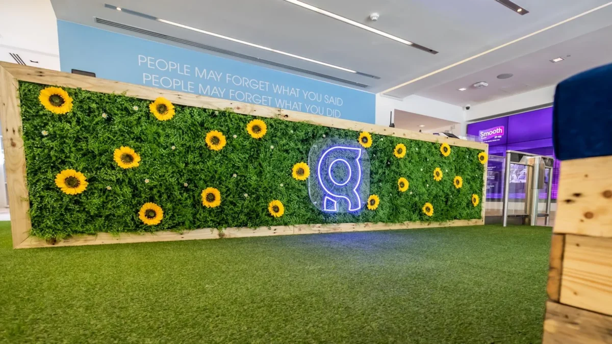 Sunflower green wall with illuminated logo in office reception