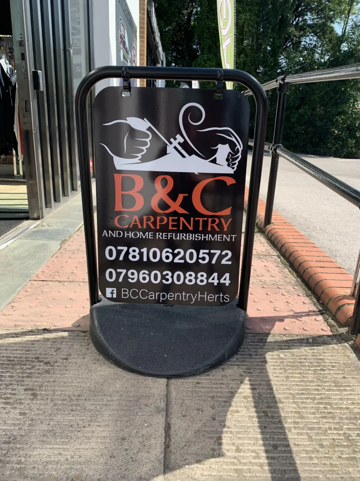 B&C Carpentry and Home Refurbishment pavement advertising sign