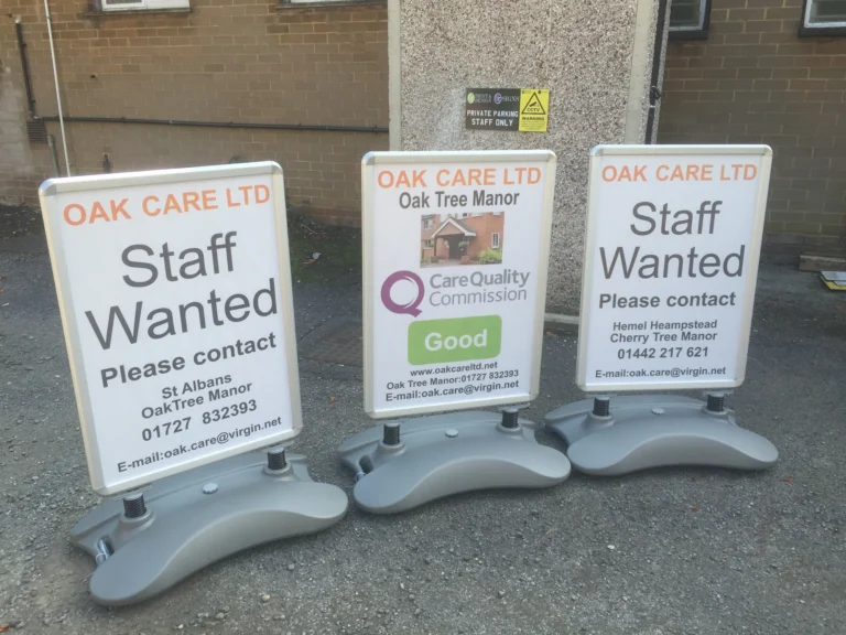 Oak Care staff recruitment signs outside a care home
