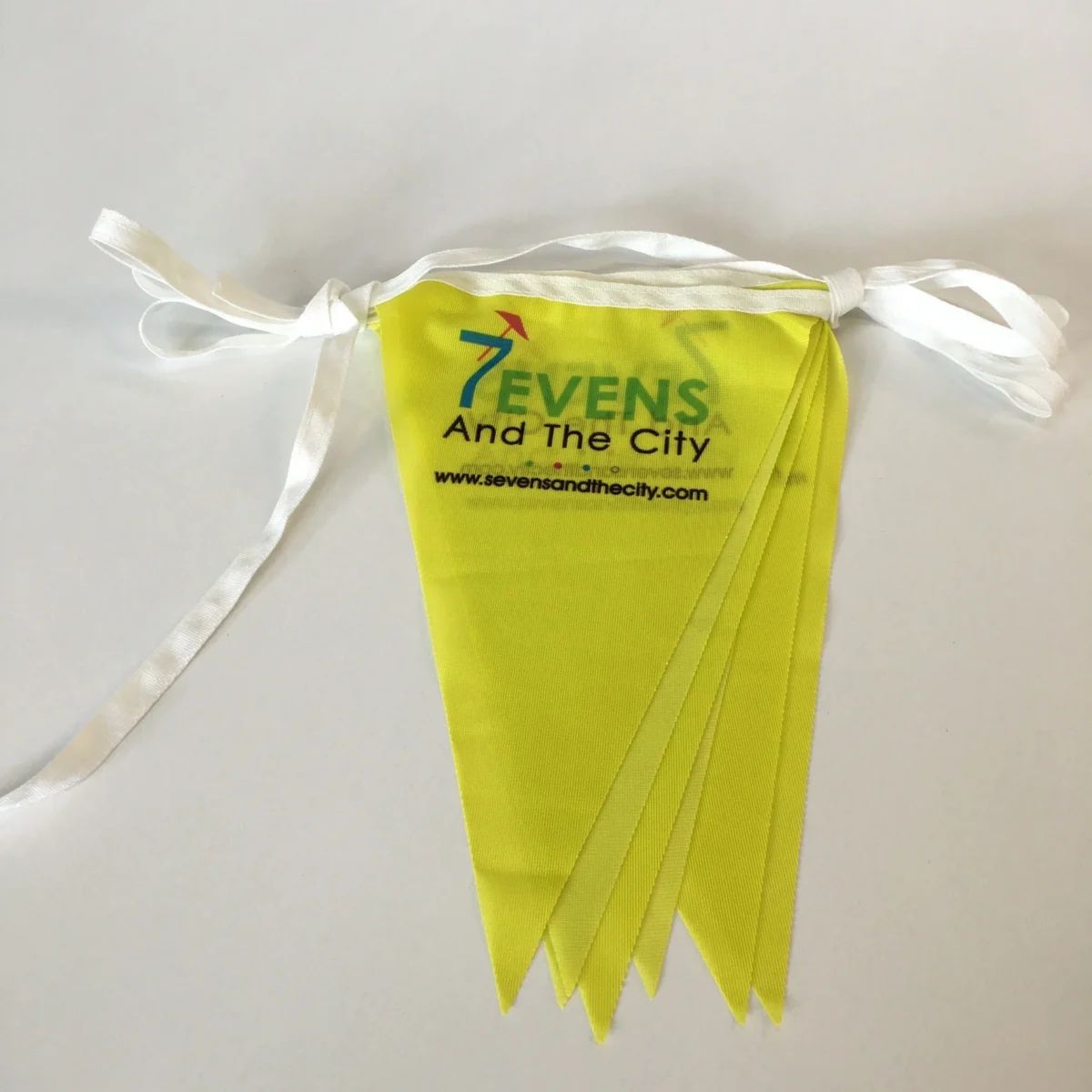 Yellow Sevens And The City branded fabric bunting