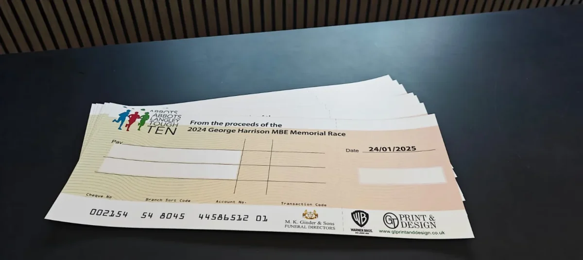 Commemorative cheque for George Harrison Memorial Race proceeds