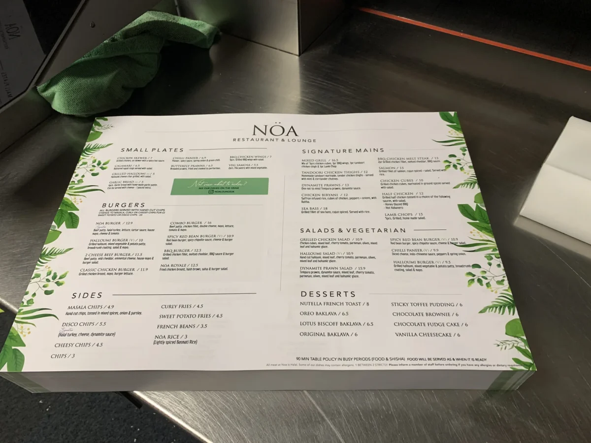 Noa Restaurant and Lounge food menu on counter