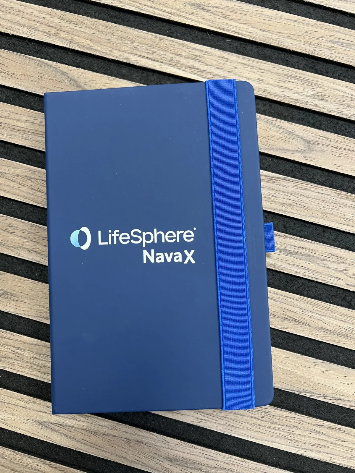 LifeSphere NavaX blue notebook with elastic strap
