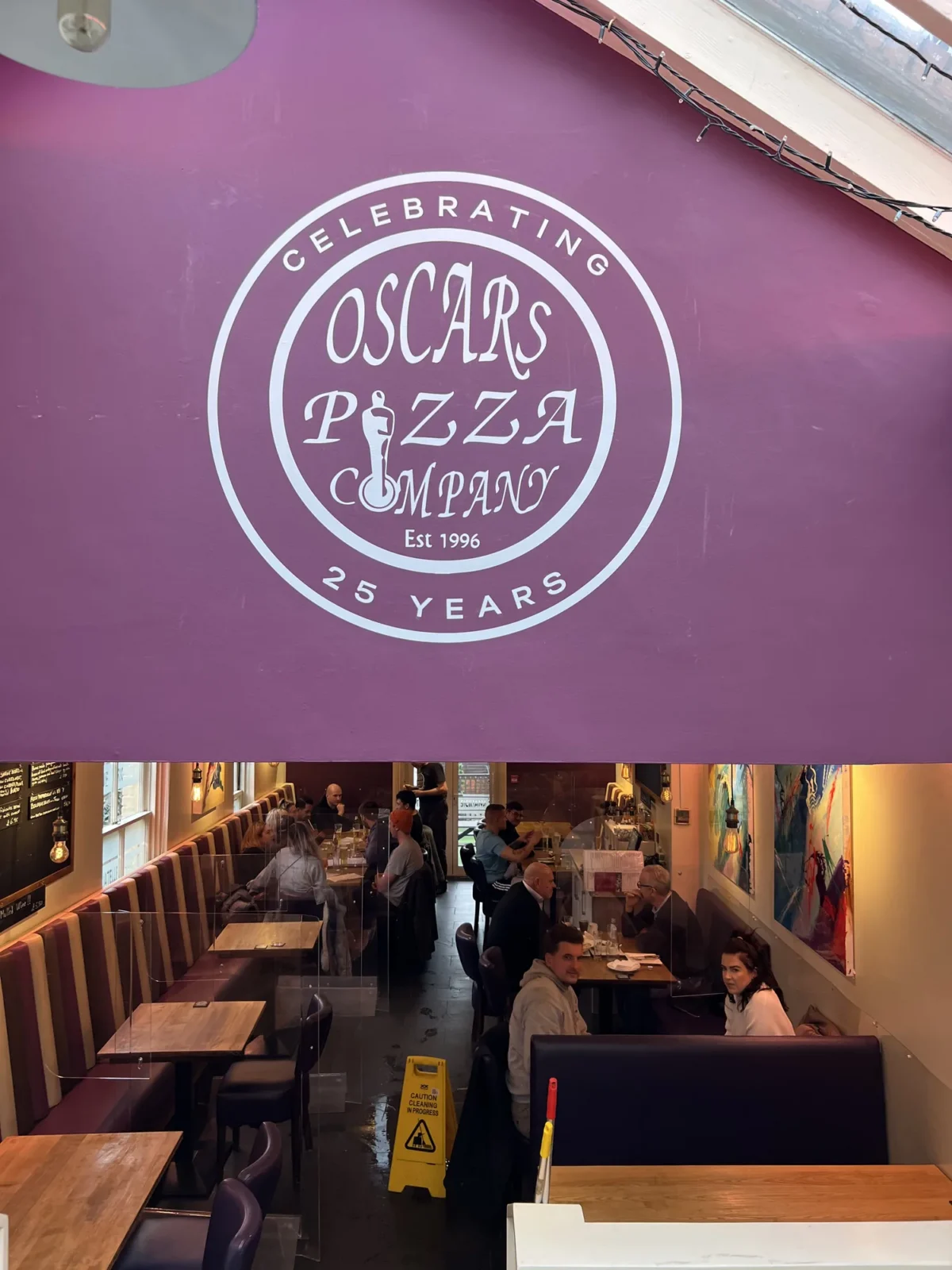 Oscar's Pizza Company restaurant interior celebrating 25 years