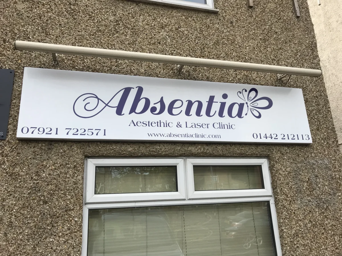 Absentia Aesthetic and Laser Clinic sign above window