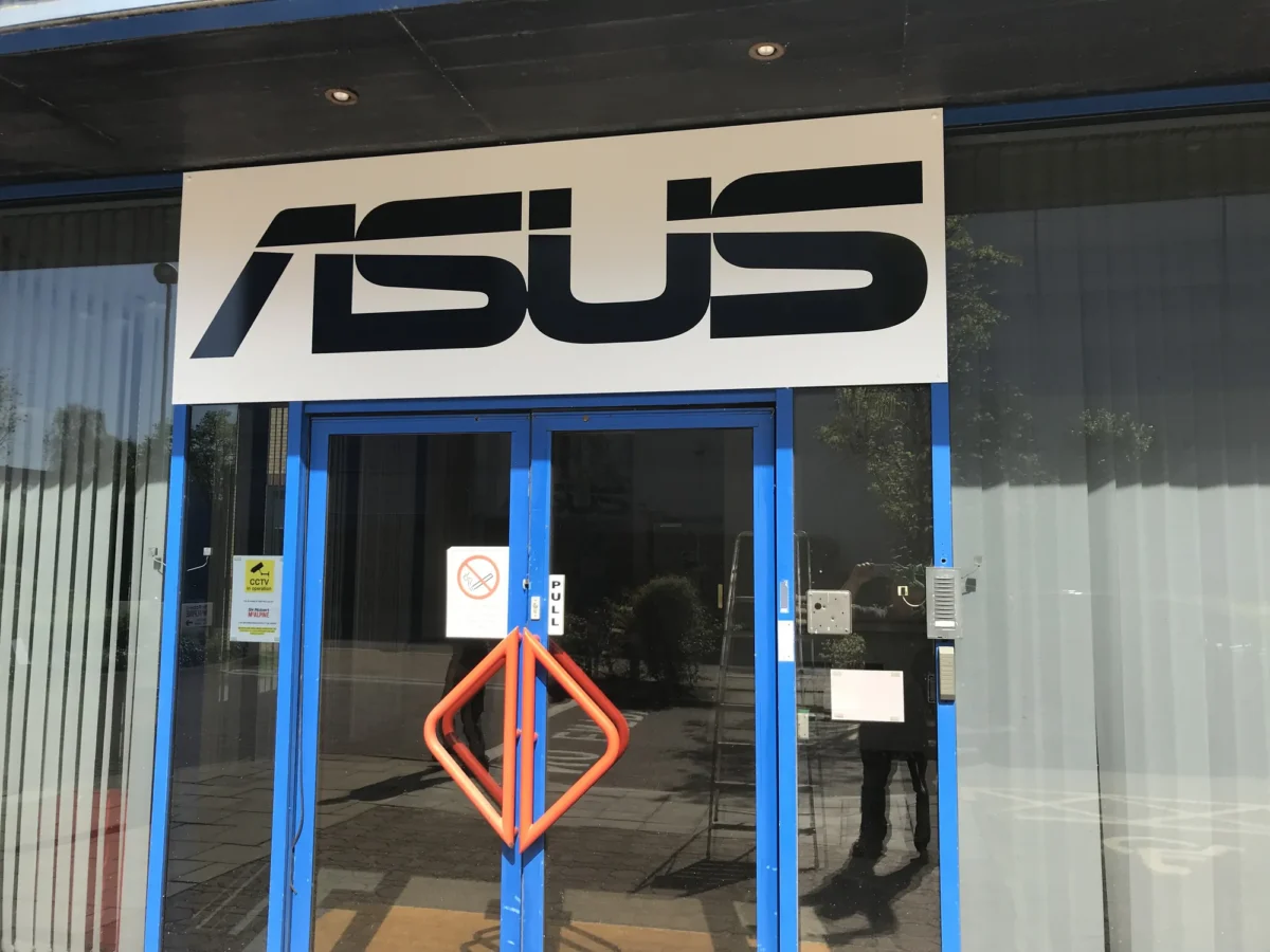 ASUS logo above blue-framed glass entrance doors
