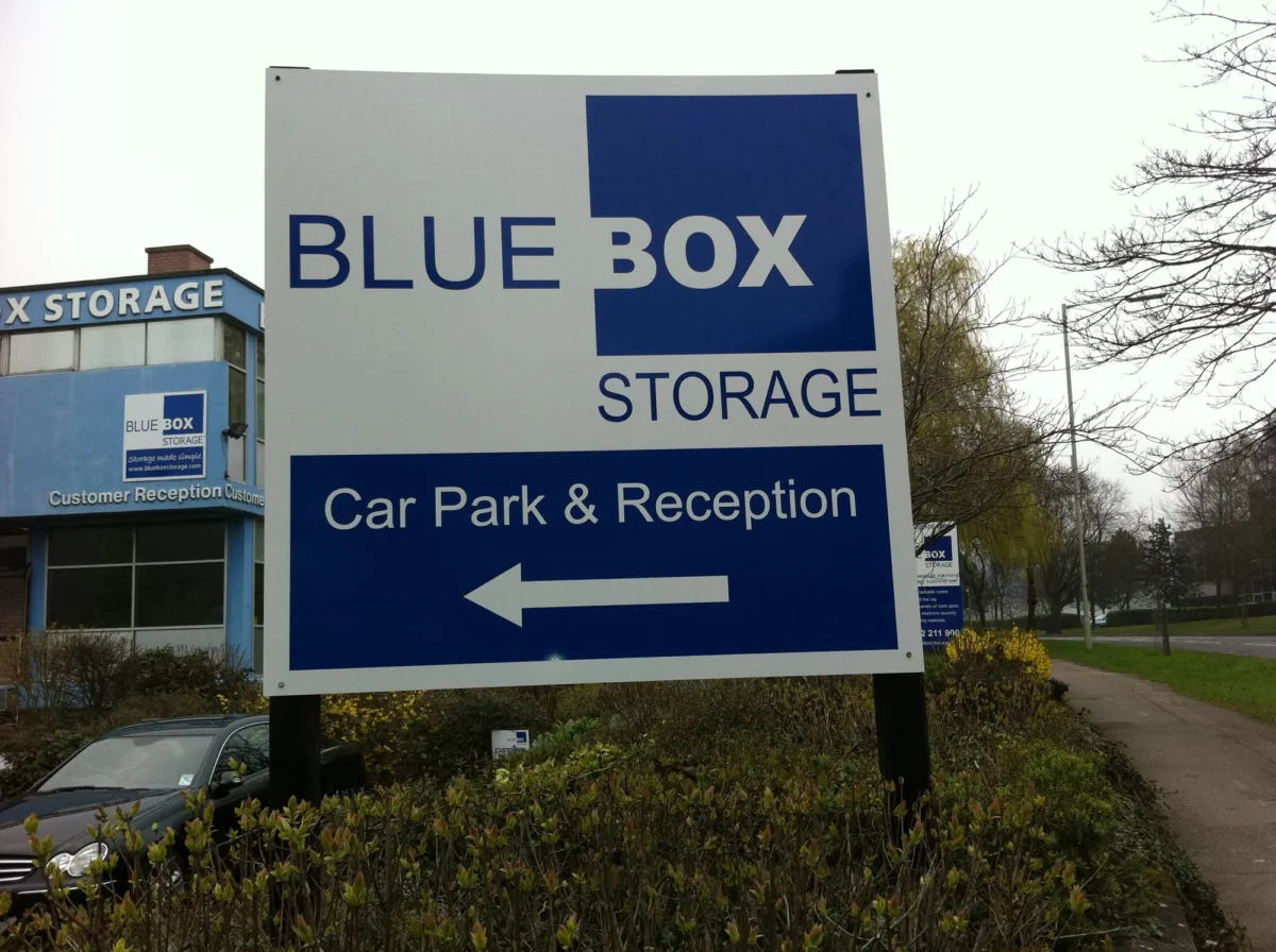Blue Box Storage sign directing to car park and reception