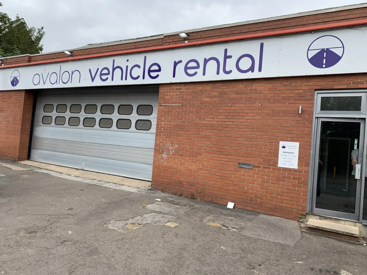Avalon Vehicle Rental garage entrance on brick building