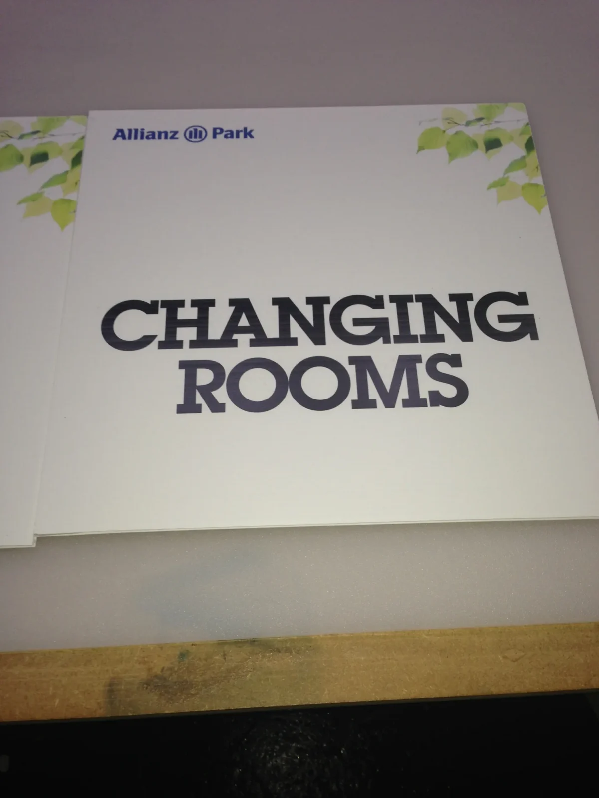 Allianz Park changing rooms sign with leafy border
