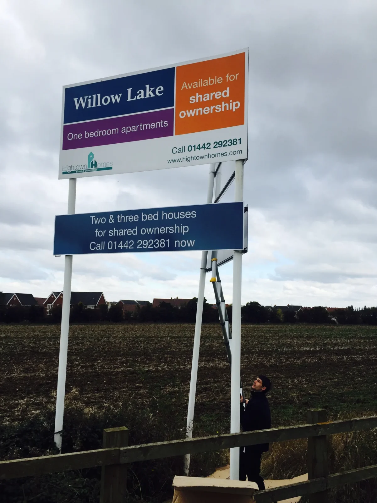 Willow Lake shared ownership housing sign beside a field