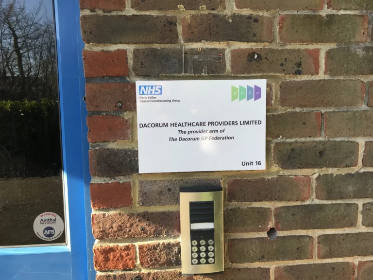 Dacorum Healthcare Providers Limited sign beside secure entry keypad