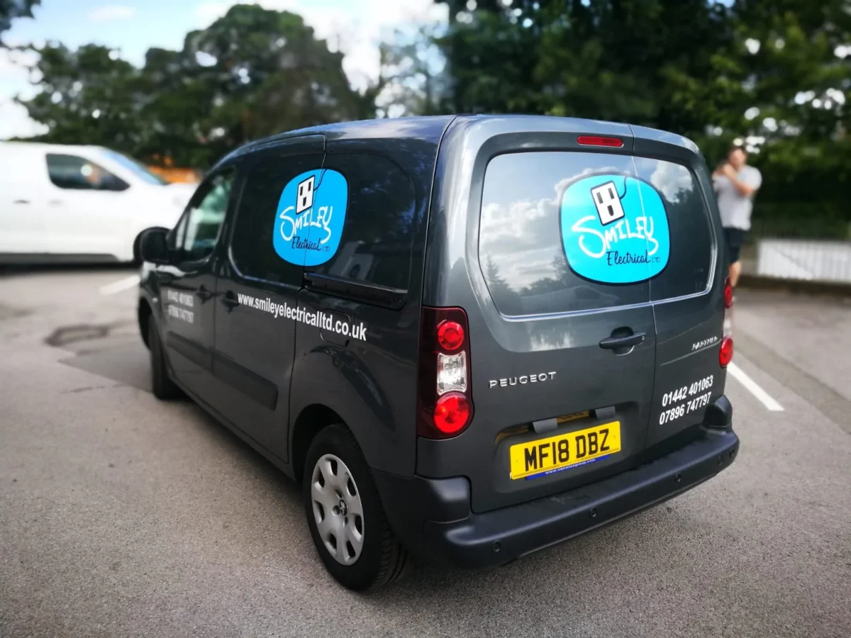 Smiley Electrical branded Peugeot van parked outdoors