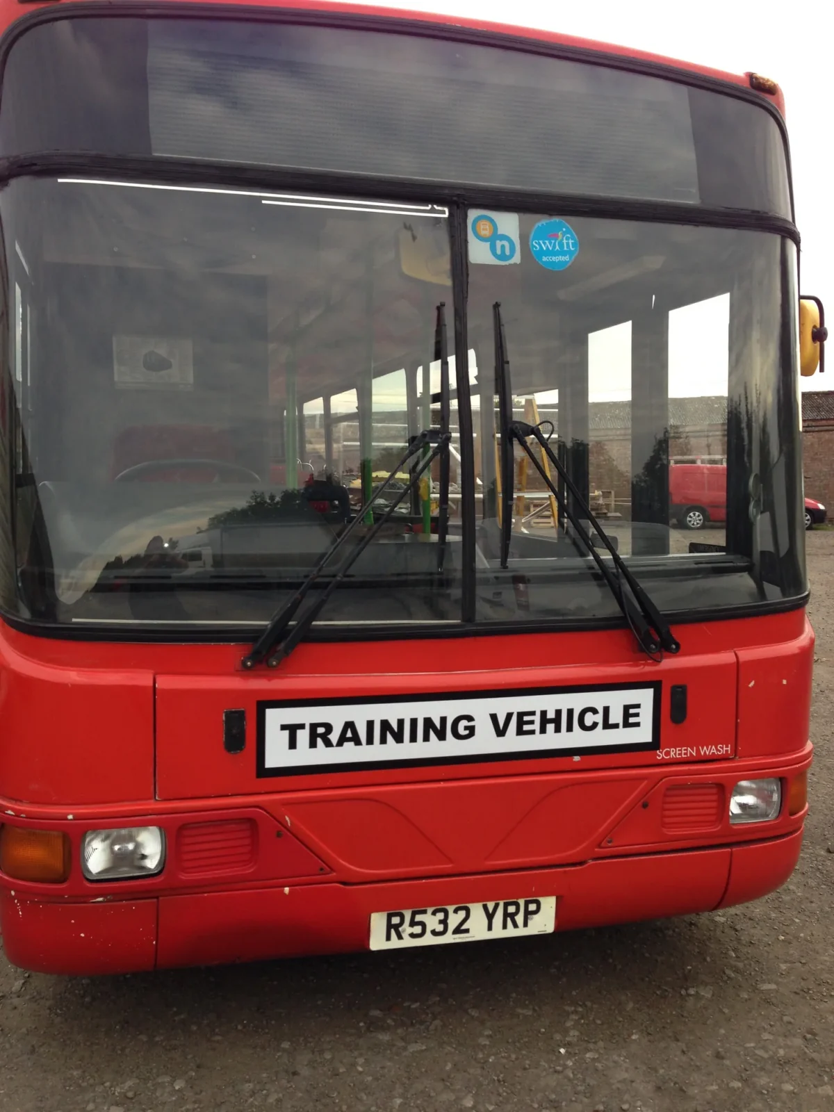 Front of red bus marked Training Vehicle