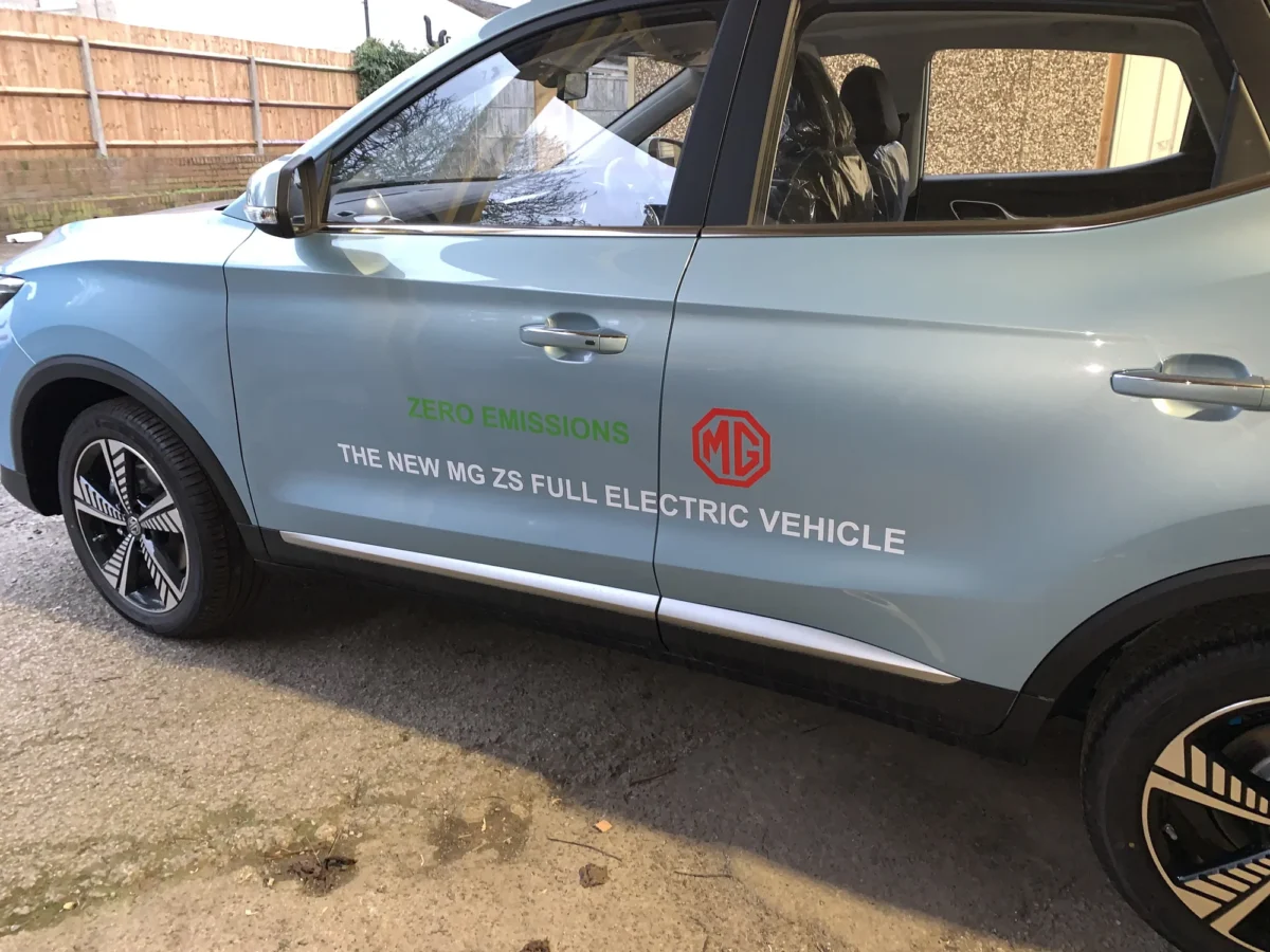Light blue MG ZS electric vehicle with zero-emissions branding