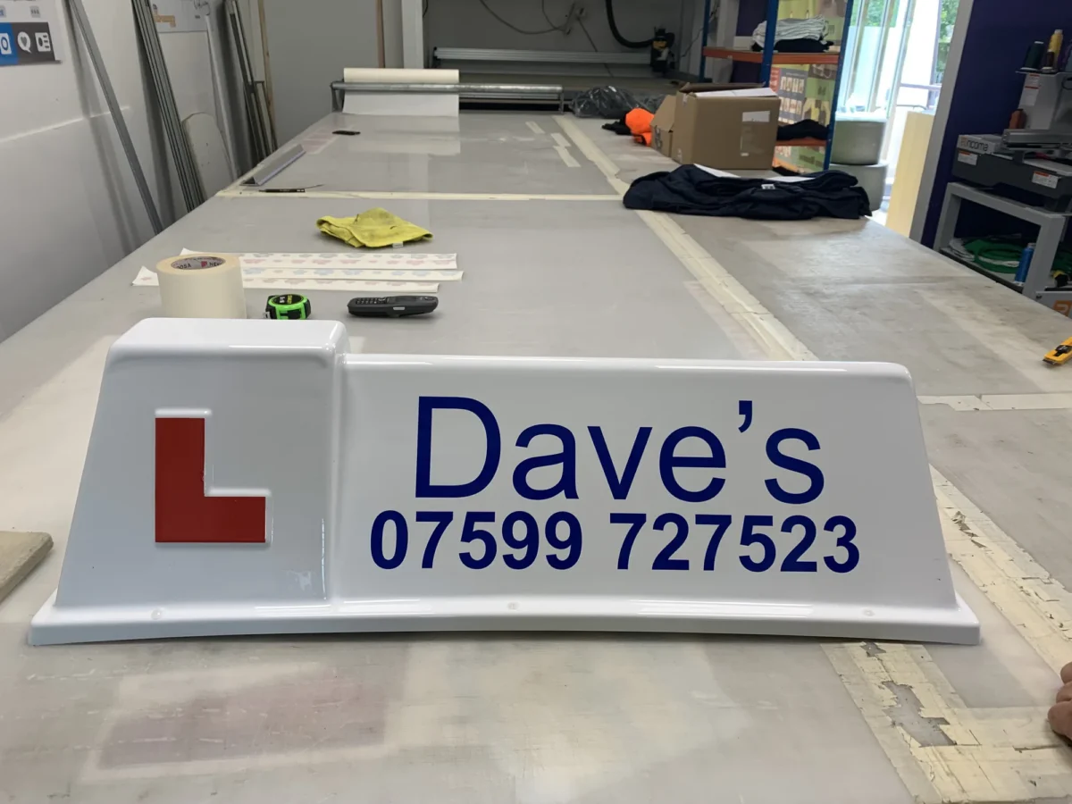 Dave’s branded taxi roof sign on workshop table