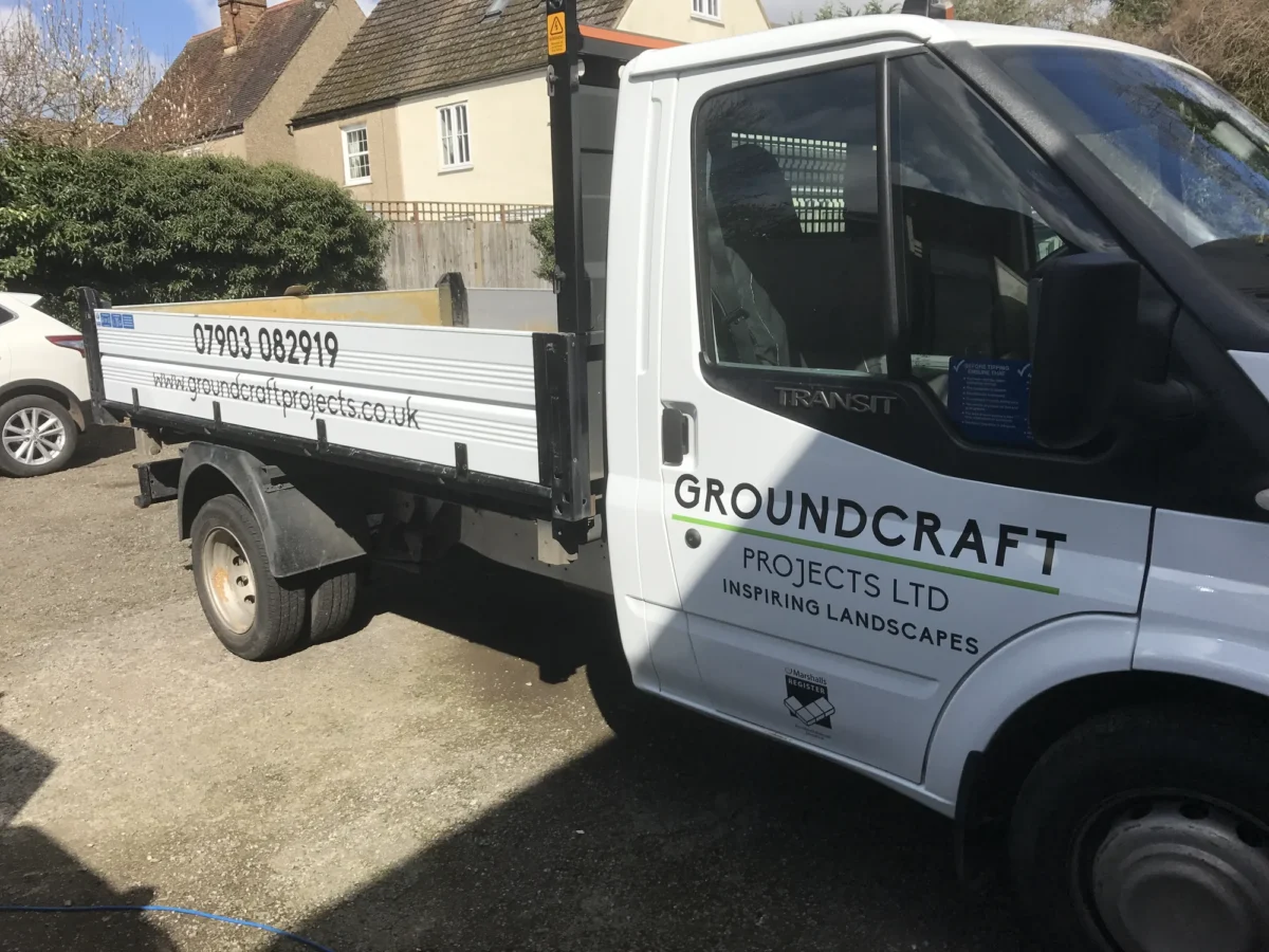 Groundcraft Projects landscaping truck parked outside a house