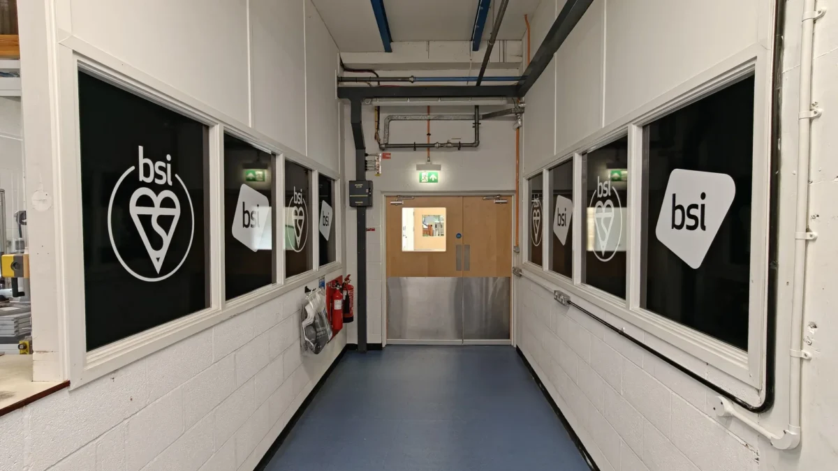 BSI-branded corridor leading to double fire doors
